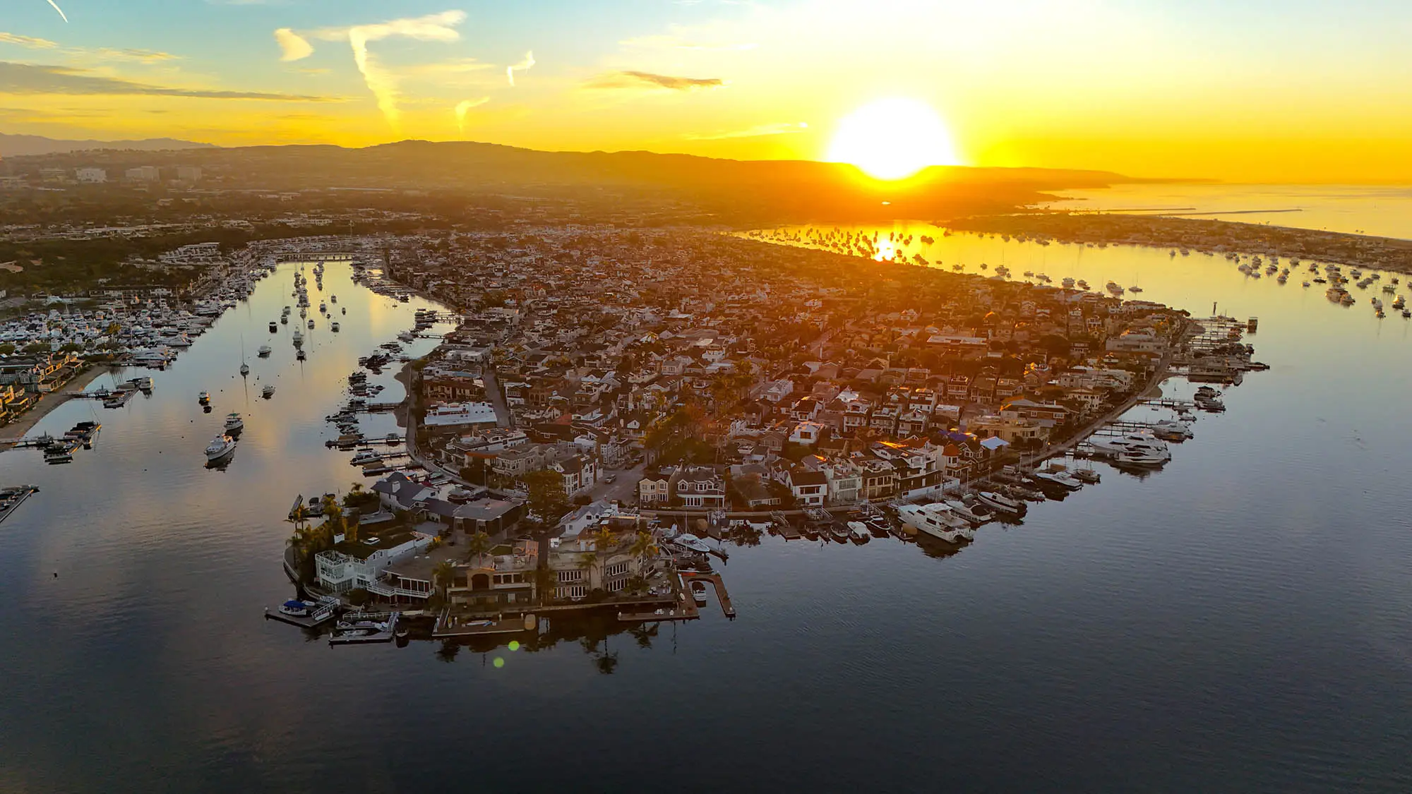 Balboa Island at sunrise, photographed from the air over Newport Harbor