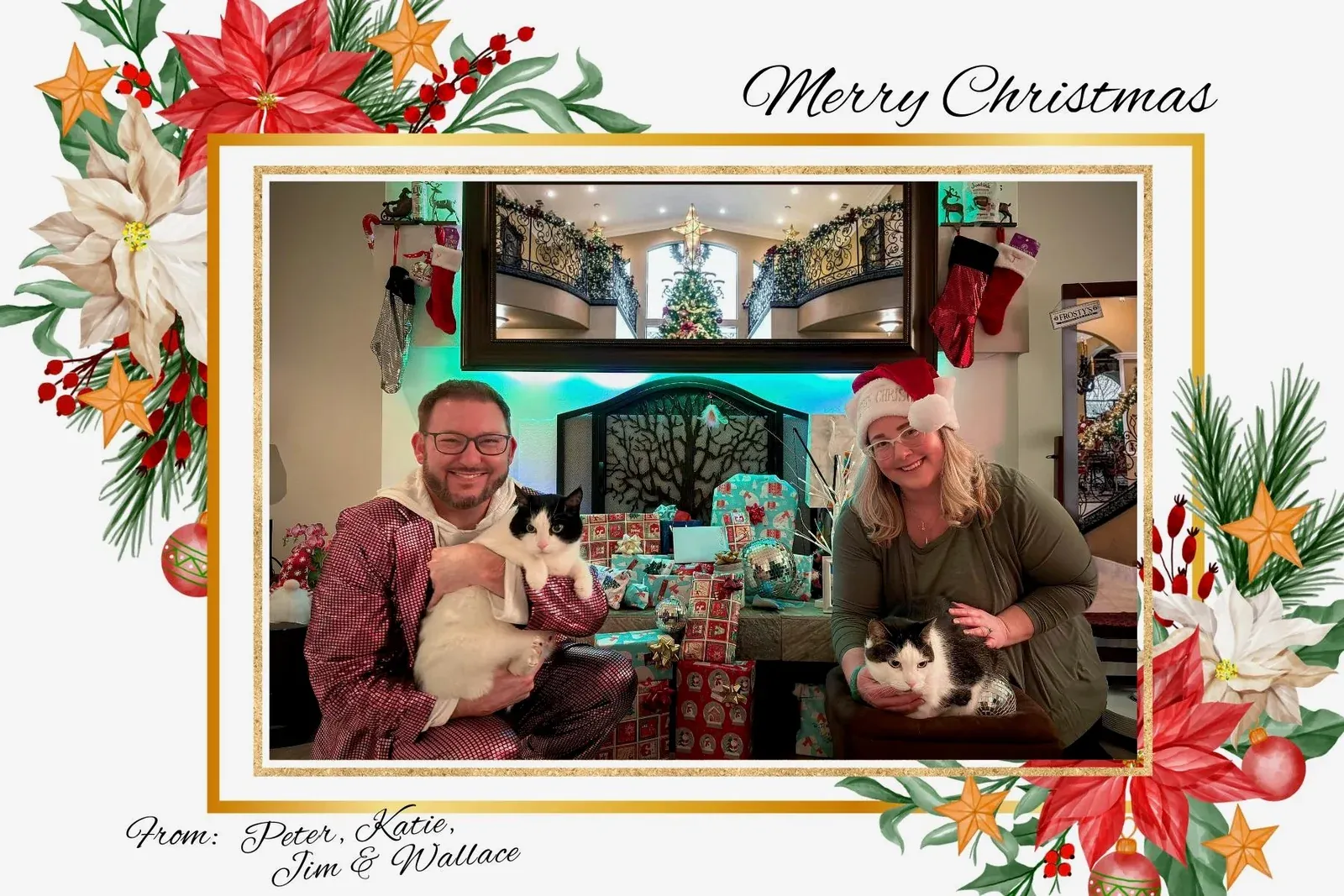 Peter and Katie's Christmas card — the two of them by a decorated fireplace, each holding one of their black-and-white cats