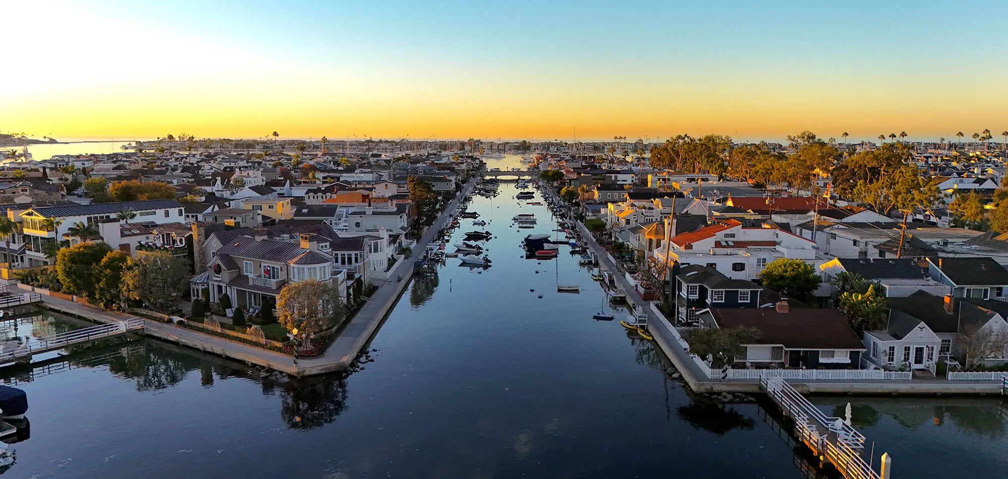 The Grand Canal between Balboa Island and Little Island at dusk